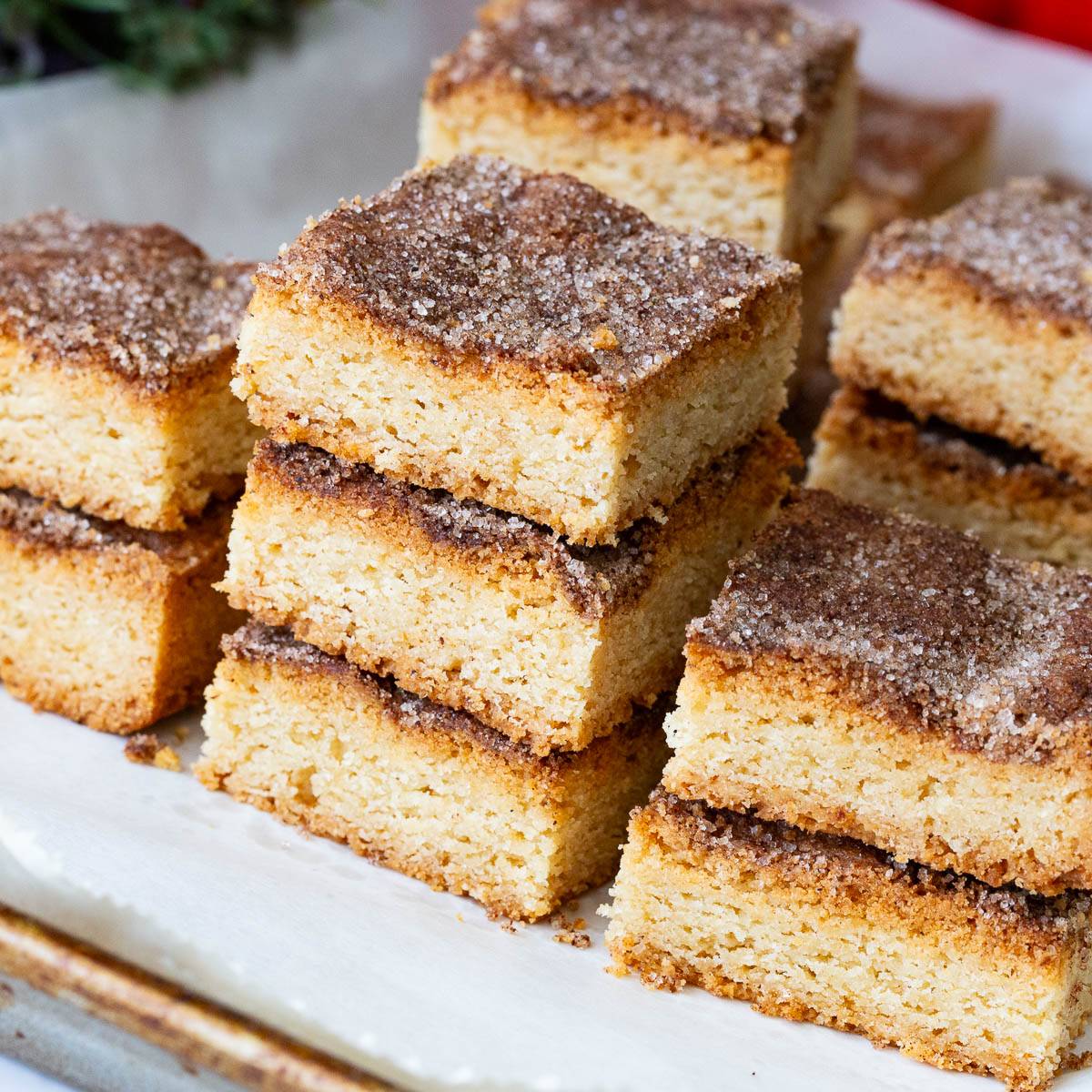 A stack of churros bars on the baking tray.