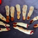 Bloody finger cookies on the table.