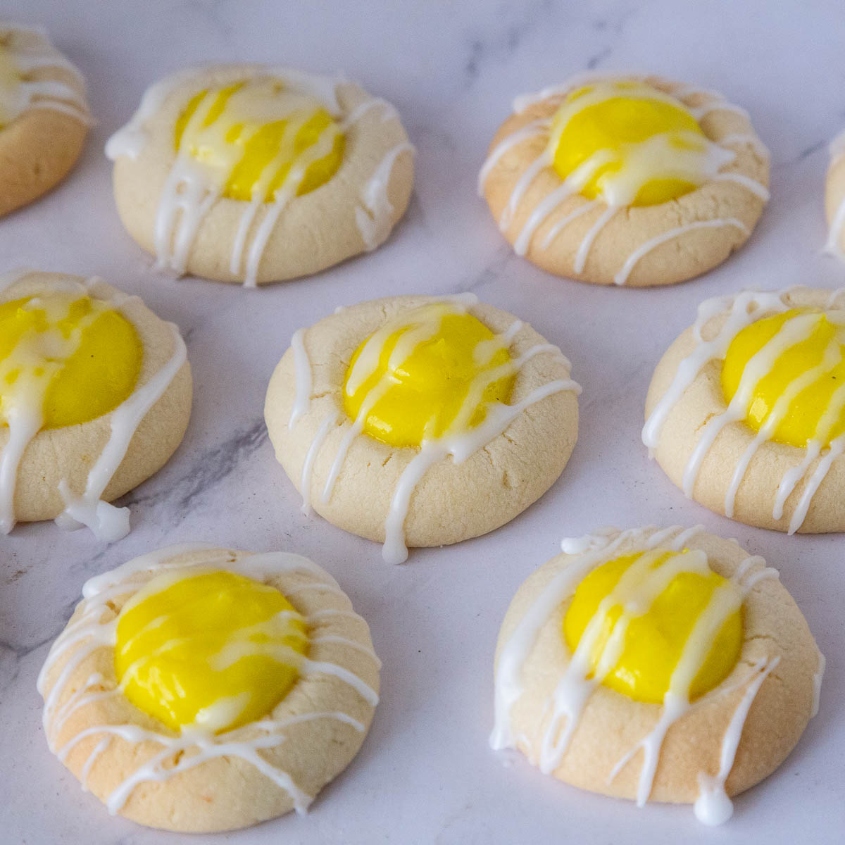 A few lemon curd cookies on the table.