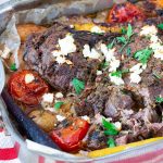 A roasting pan with Roast leg of lamb - Greek style.