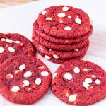 A stack of red velvet chocolate chip cookies.