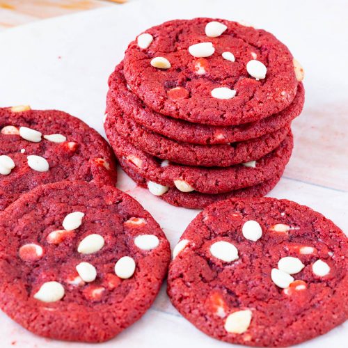 A stack of red velvet chocolate chip cookies.