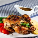 A roasted chicken on a platter.