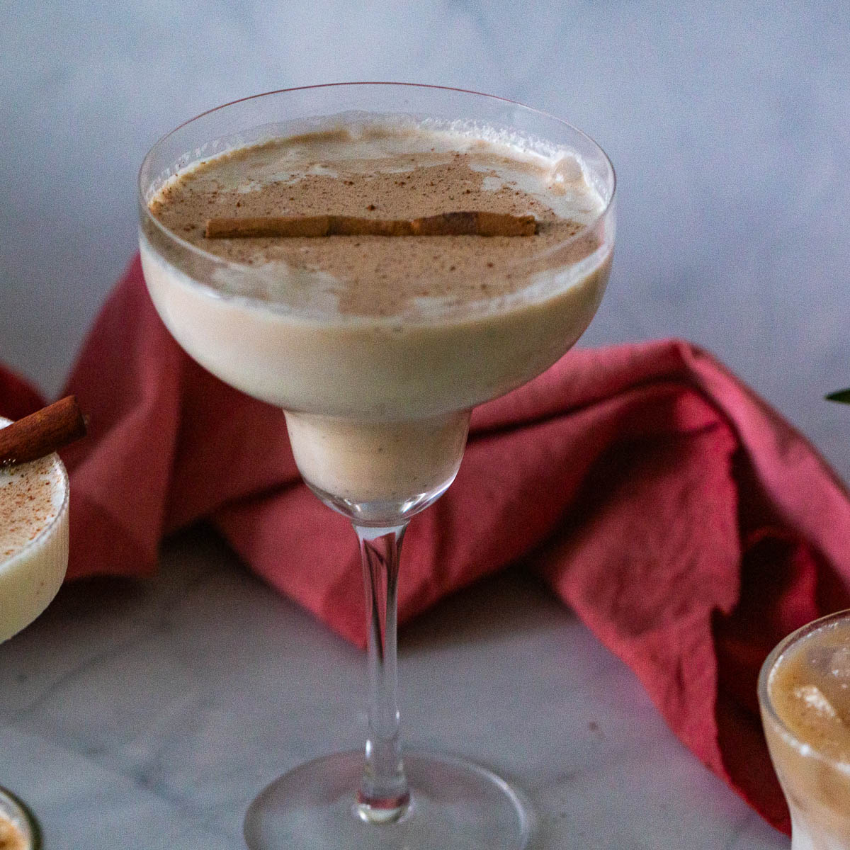 A cocktail glass with baileys eggnog.
