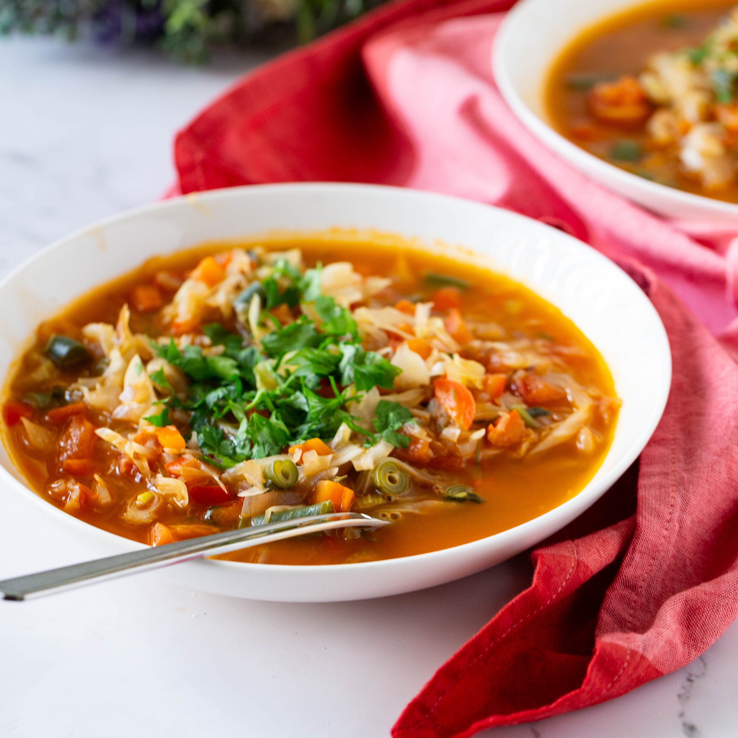 Detox soup with cabbage in a bowl.