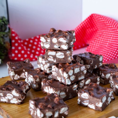 Stacked Marshmallow fudge Bars on the table.