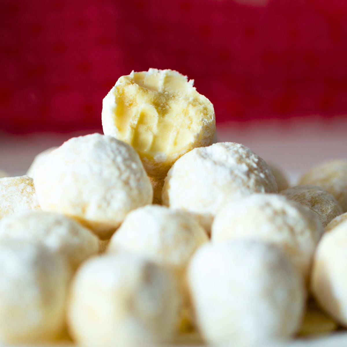 Truffles on a plate with white chocolate.