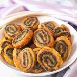 A bowl with puff pastry pinwheels.