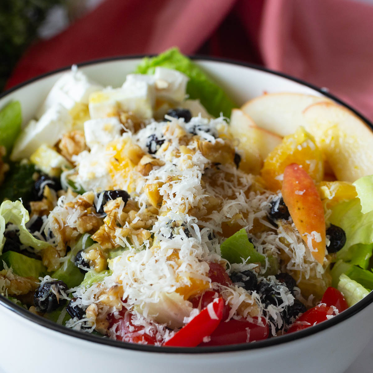 A white bowl with salad.