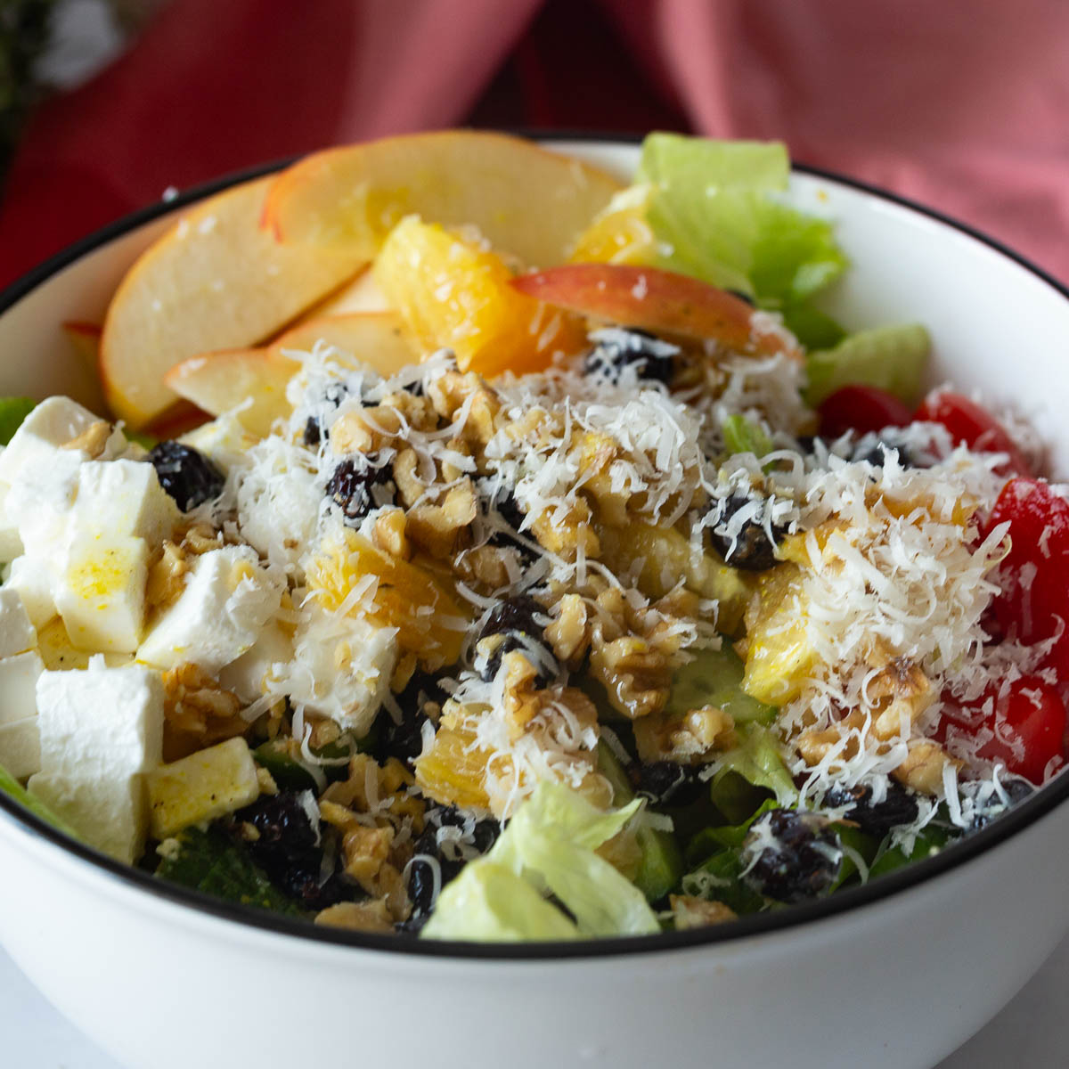 A white bowl with salad.
