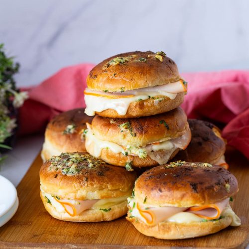 Stack of slider buns on the table.
