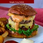 Pinterest image for a double cheeseburger with Fries.
