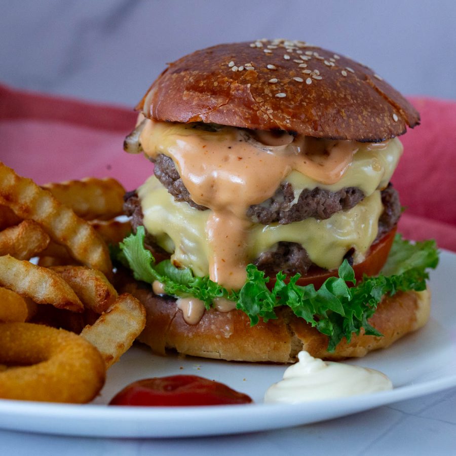 A double patty burger with homemade sauce.