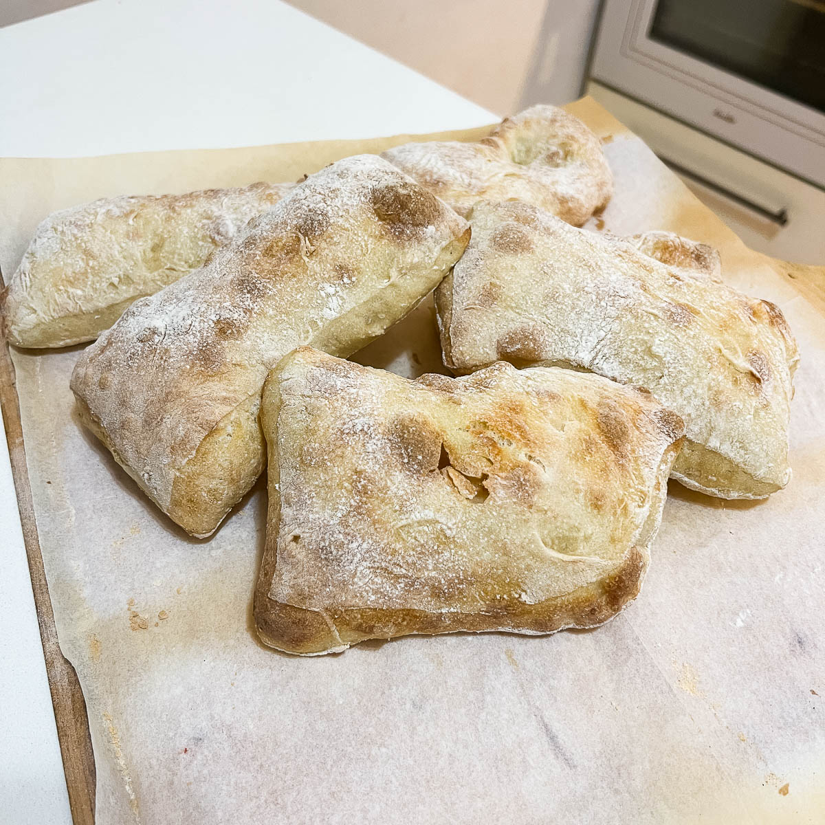 Ciabatta stacked on the table.
