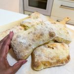 Hand holding Ciabatta recipe.