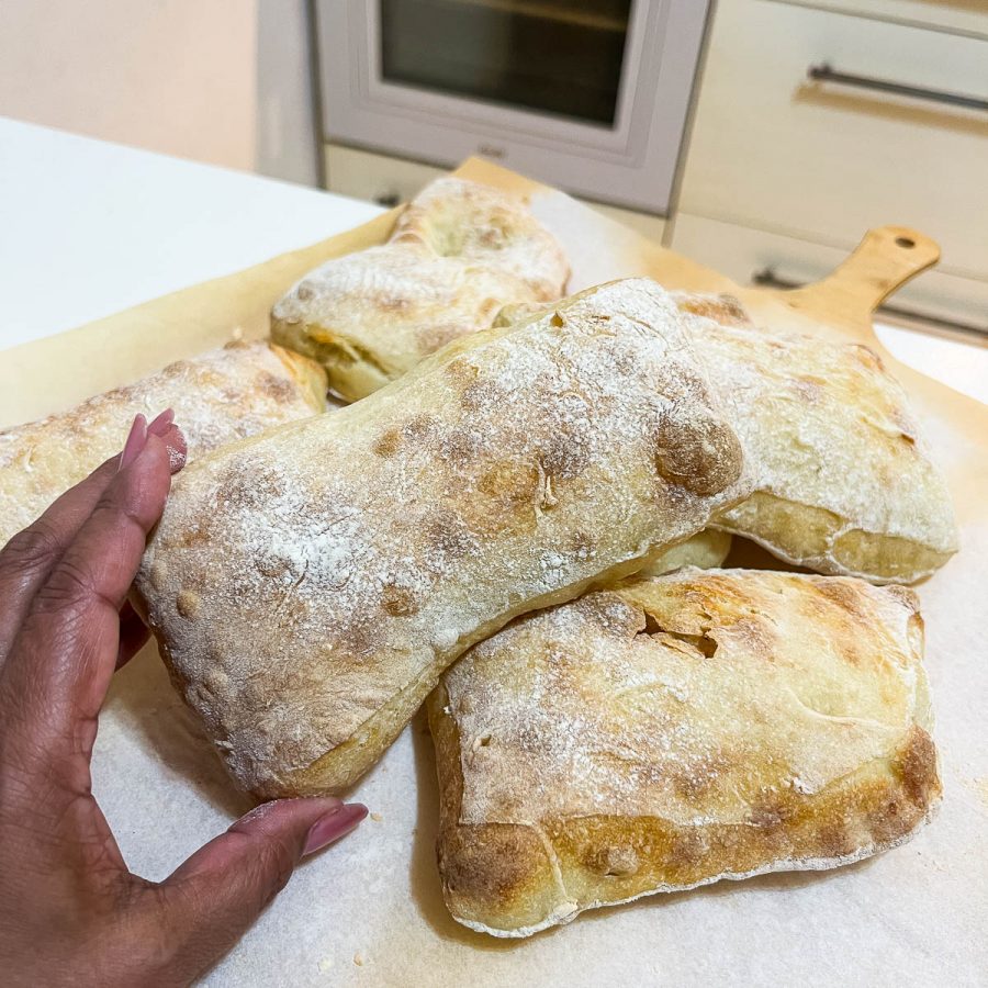 Hand holding Ciabatta recipe.