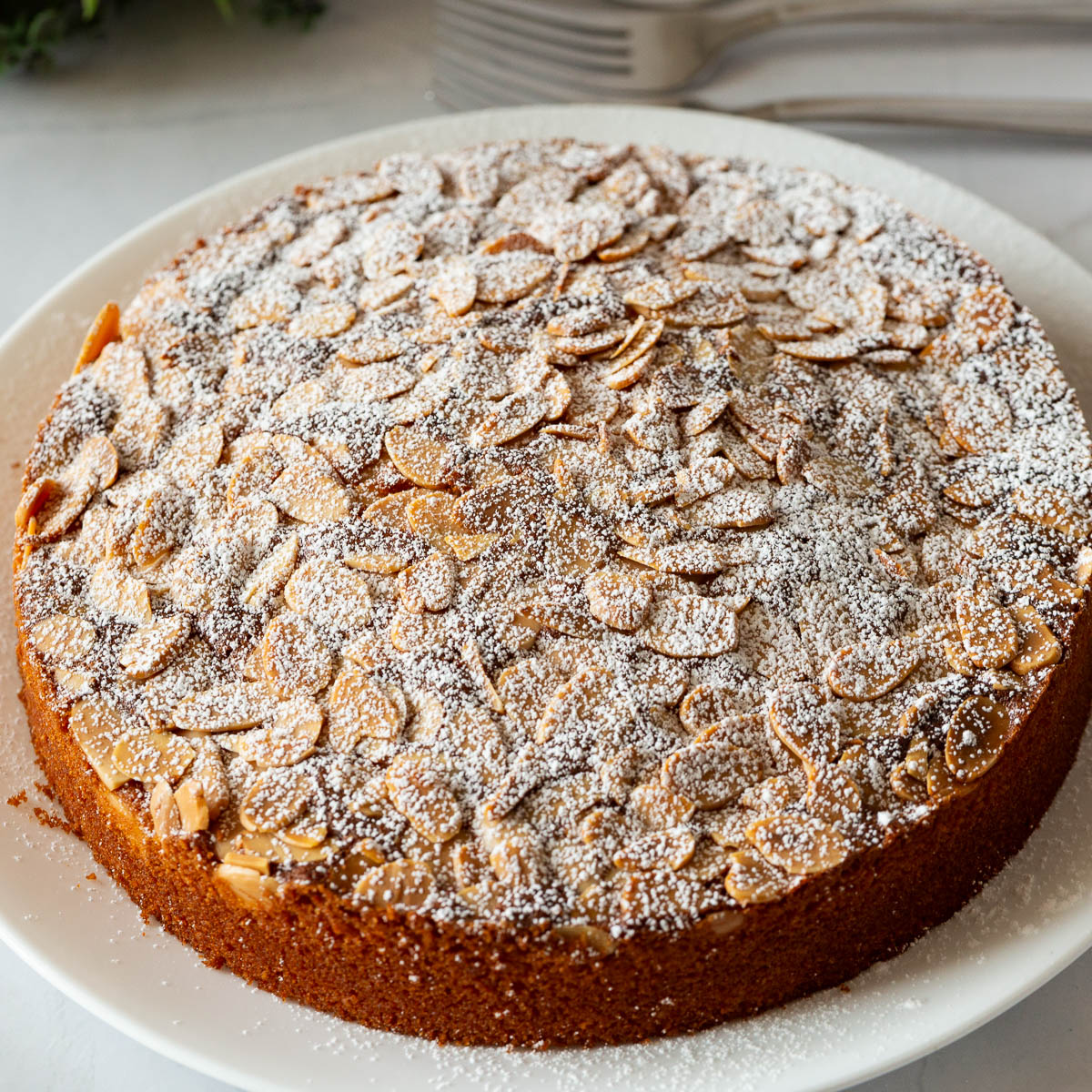 A baked almond cake on the plate.
