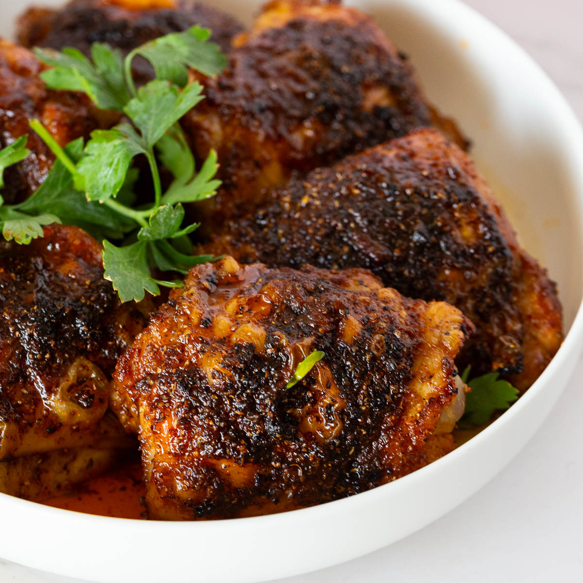 A plate with spicy chicken thighs.