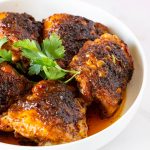 A plate with spicy chicken thighs.