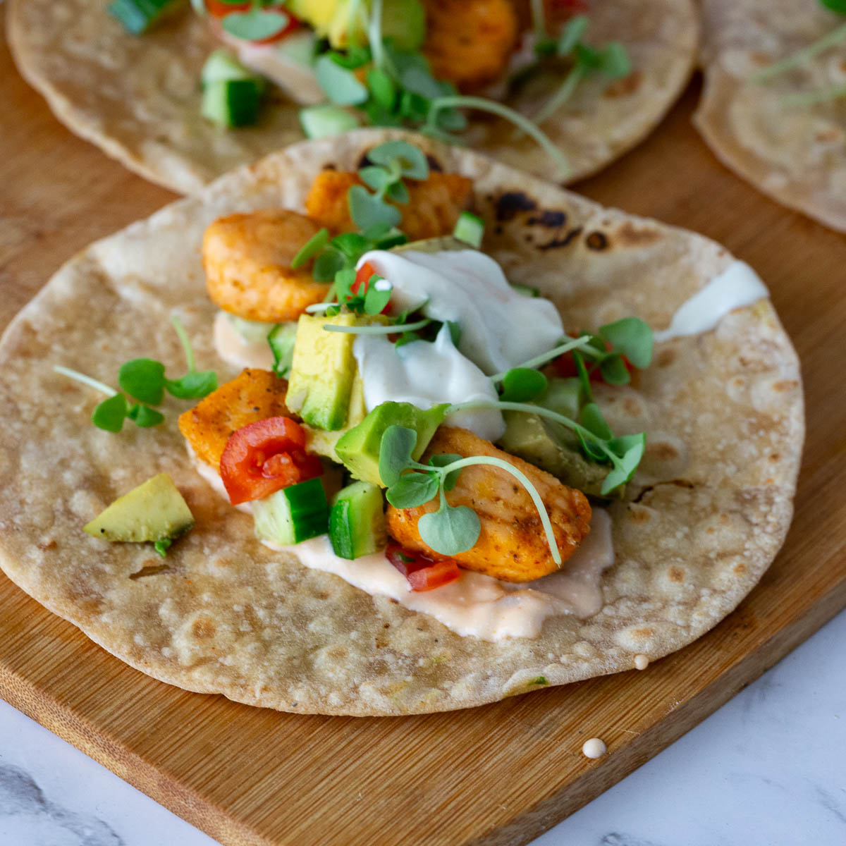 Tacos topped with Whole wheat tortillas.