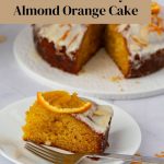 A sliced orange cake on the table.
