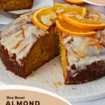 A sliced glazed orange cake.