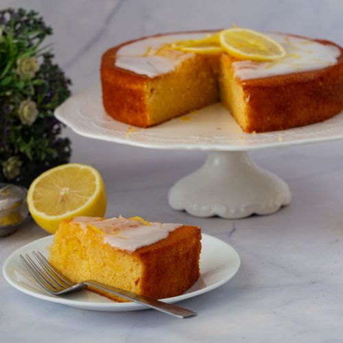 A sliced coffee lemon cake on the table.