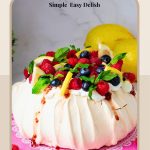 Pinterest image for Pavlova recipe with Lemon Curd and Raspberries.