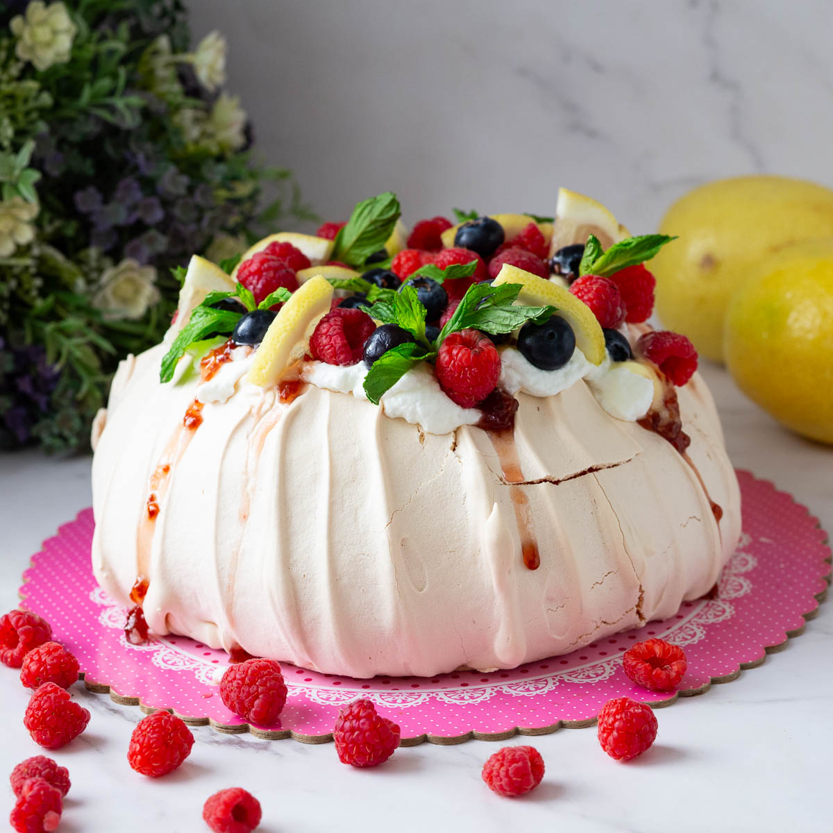 A frosted pavlova on the table.