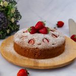 A strawberry cake on the table.