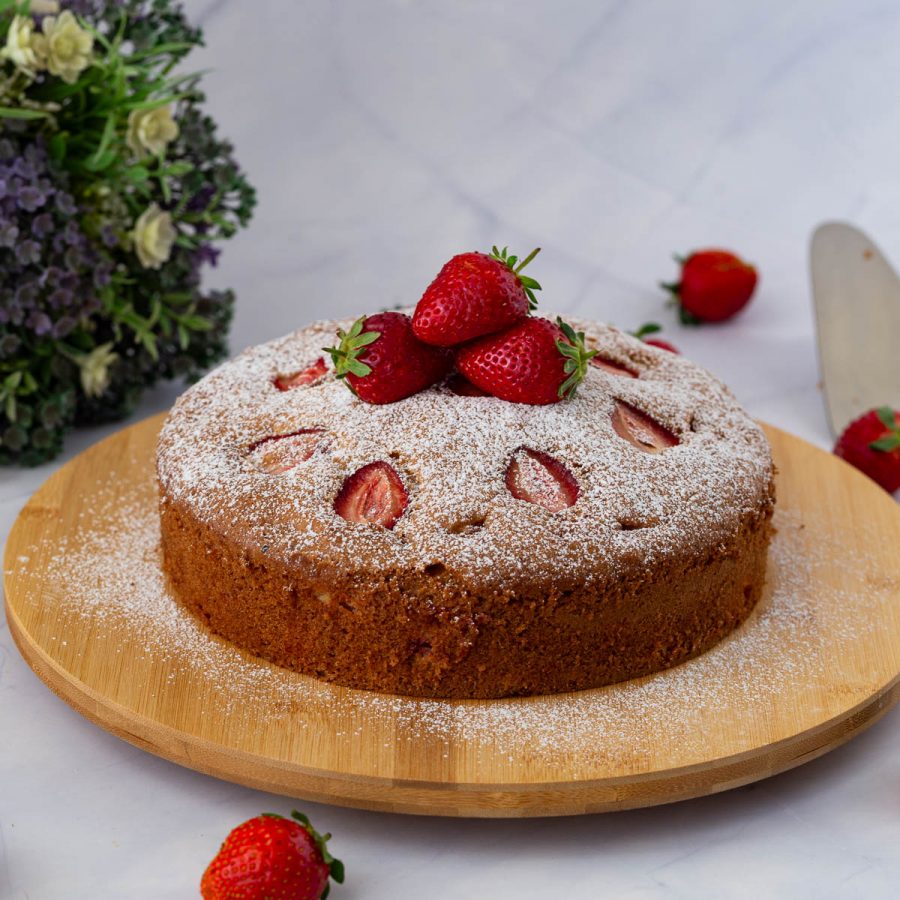 A strawberry cake on the table.