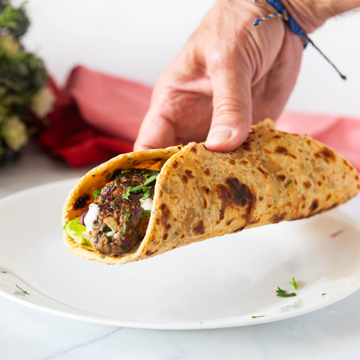 A flatbread wrap in my hands.