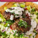 Pinterest image for kofta kebabs with salad and tahini.