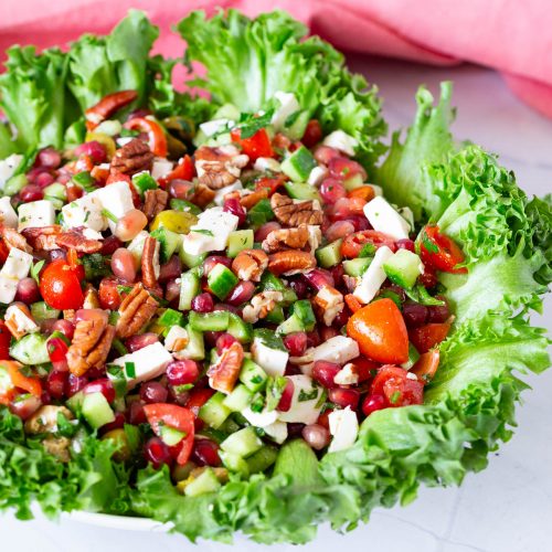 A platter with pomegranate salad.