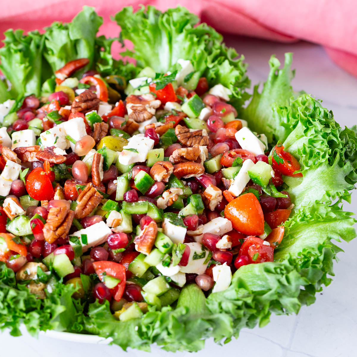 A platter with pomegranate salad.
