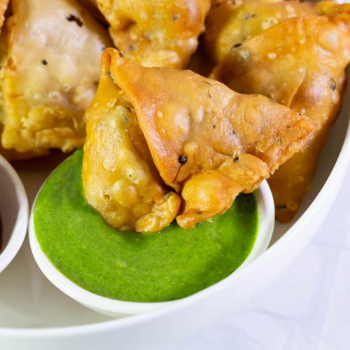 Punjabi samosa with green chutney.