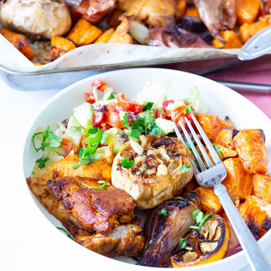A plate served with chicken and veggies.