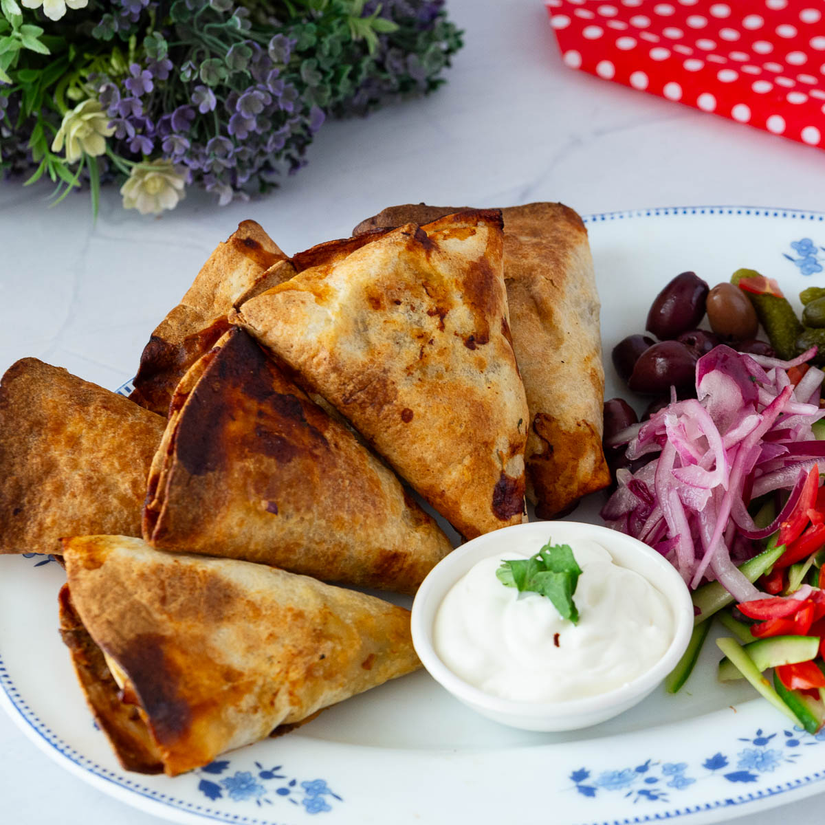 A plate with beef roll cones.