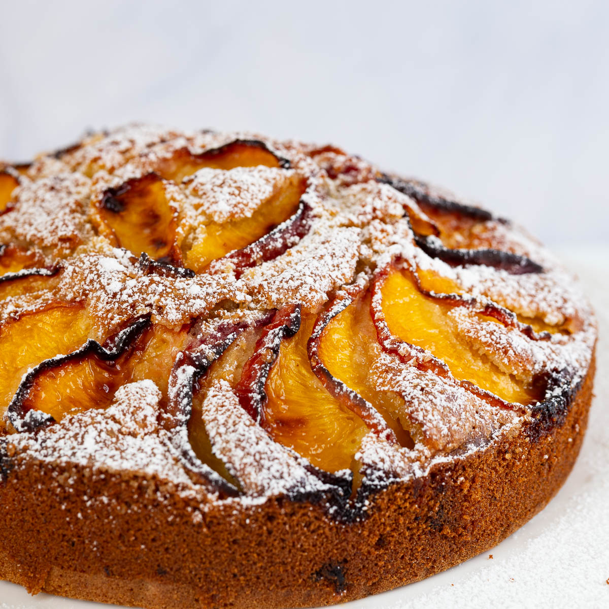 A peach cake on the table.