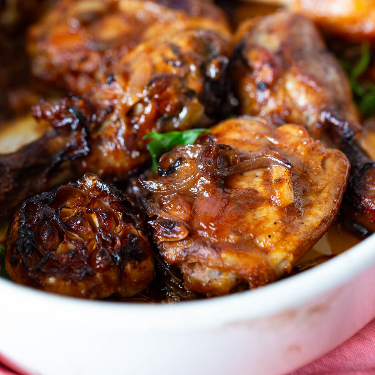 Hot honey chicken in a white baking dish.