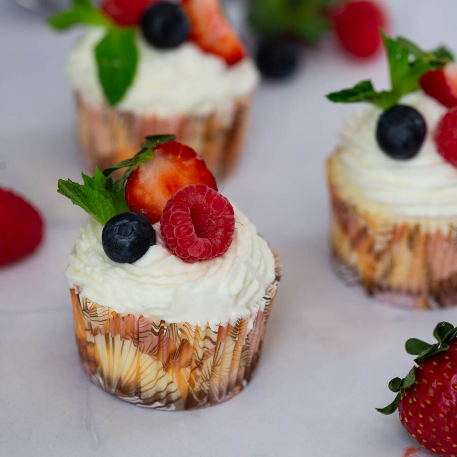 Baked mini cheesecakes on the table.