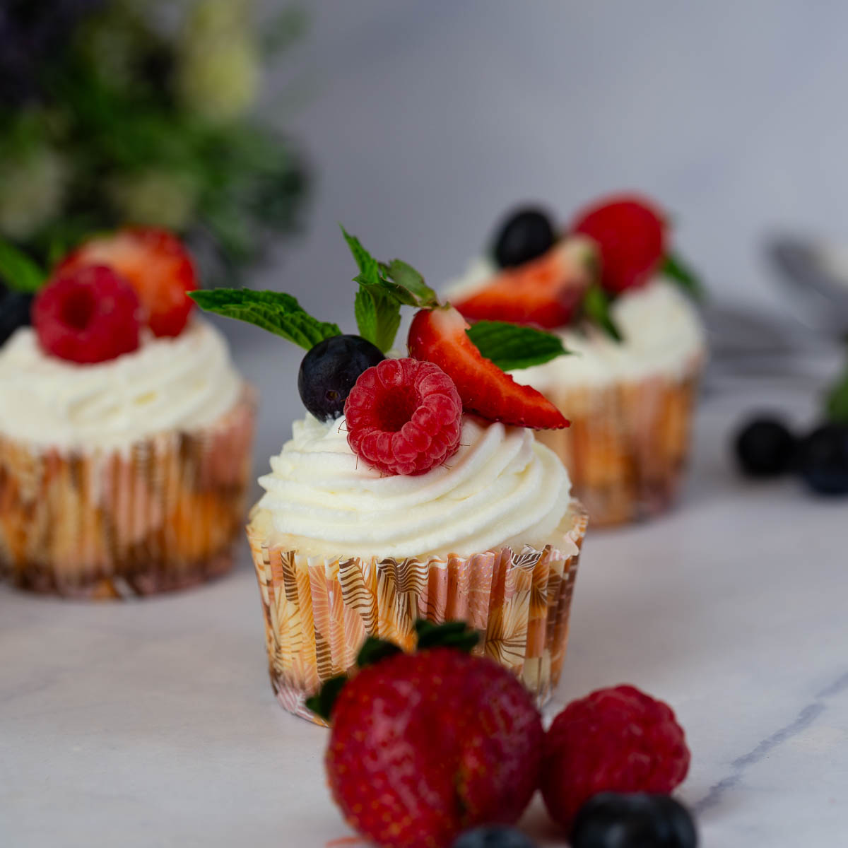 Baked mini cheesecakes on the table.