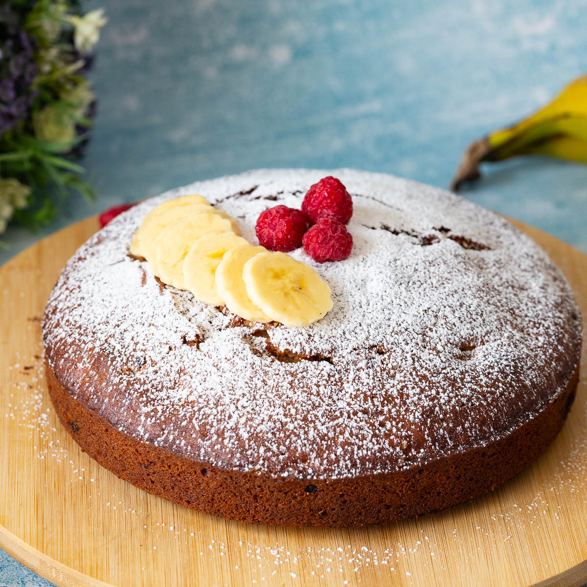 A cake layer dusted with powdered sugar.