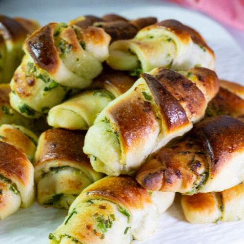 Dinner rolls with scallions on the table.