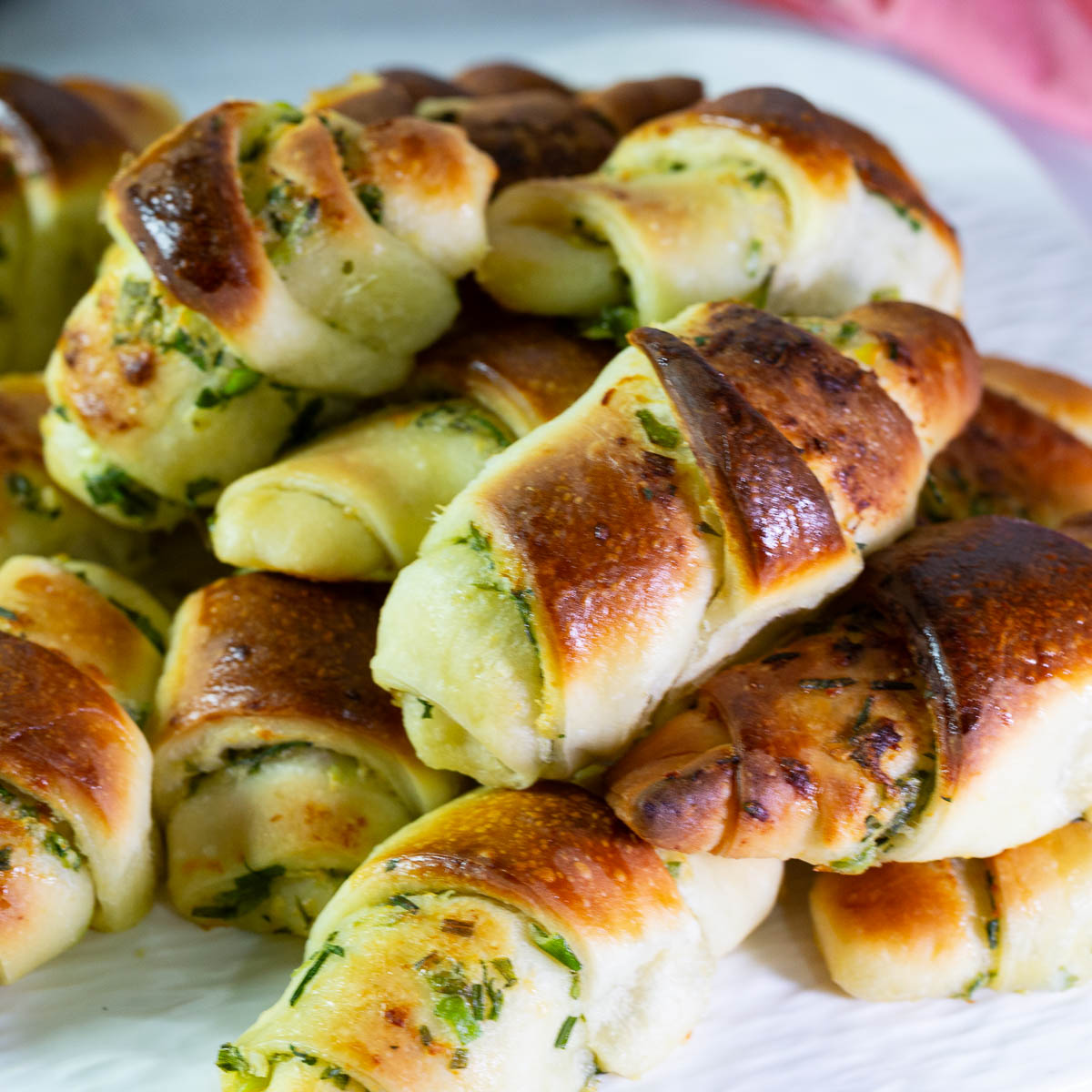 Dinner rolls with scallions on the table.