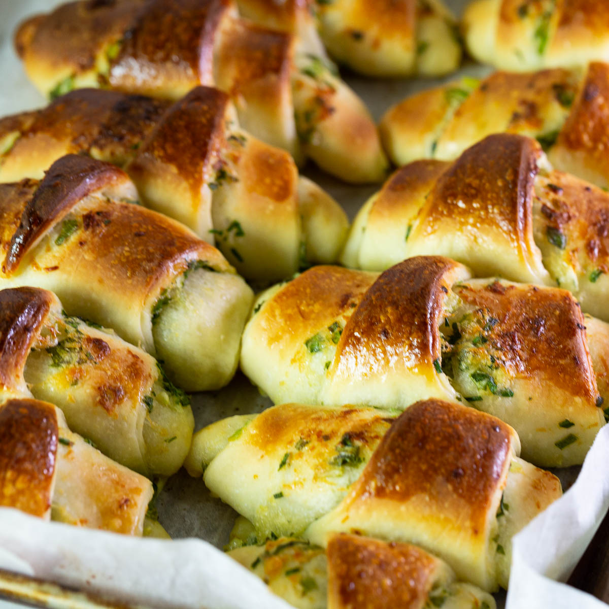 Baked scallion rolls on the table.