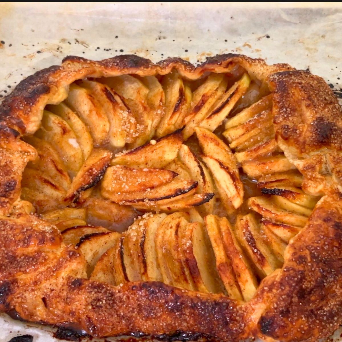 Baked apple galette on the baking tray.