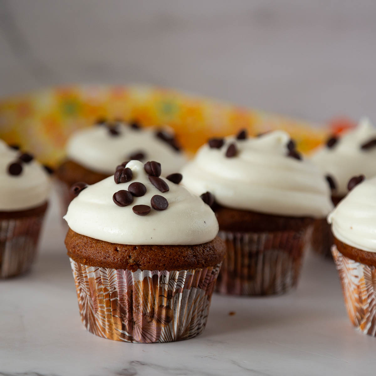 Pumpkin cupcakes on the table.