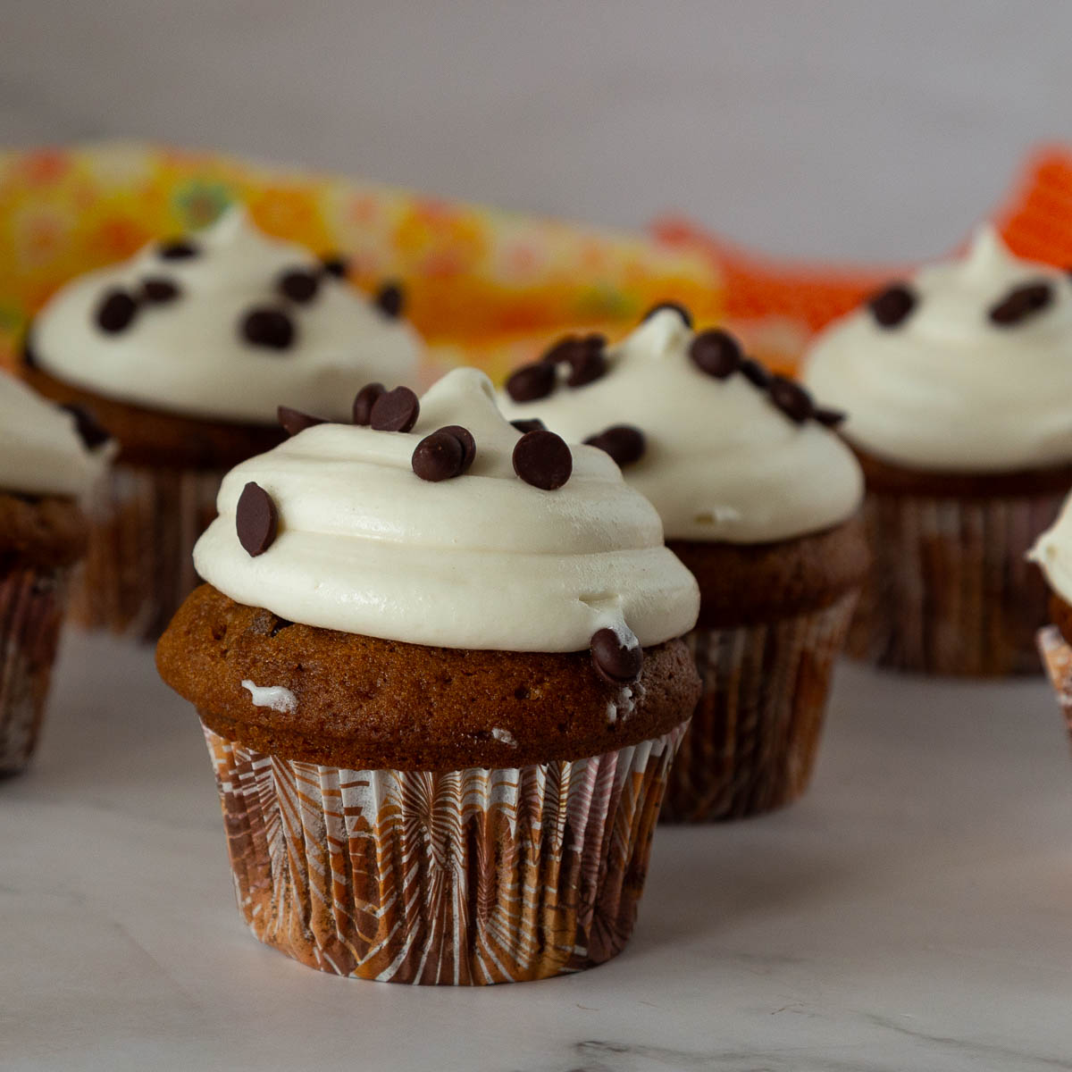 Frosted cupcakes on the table.