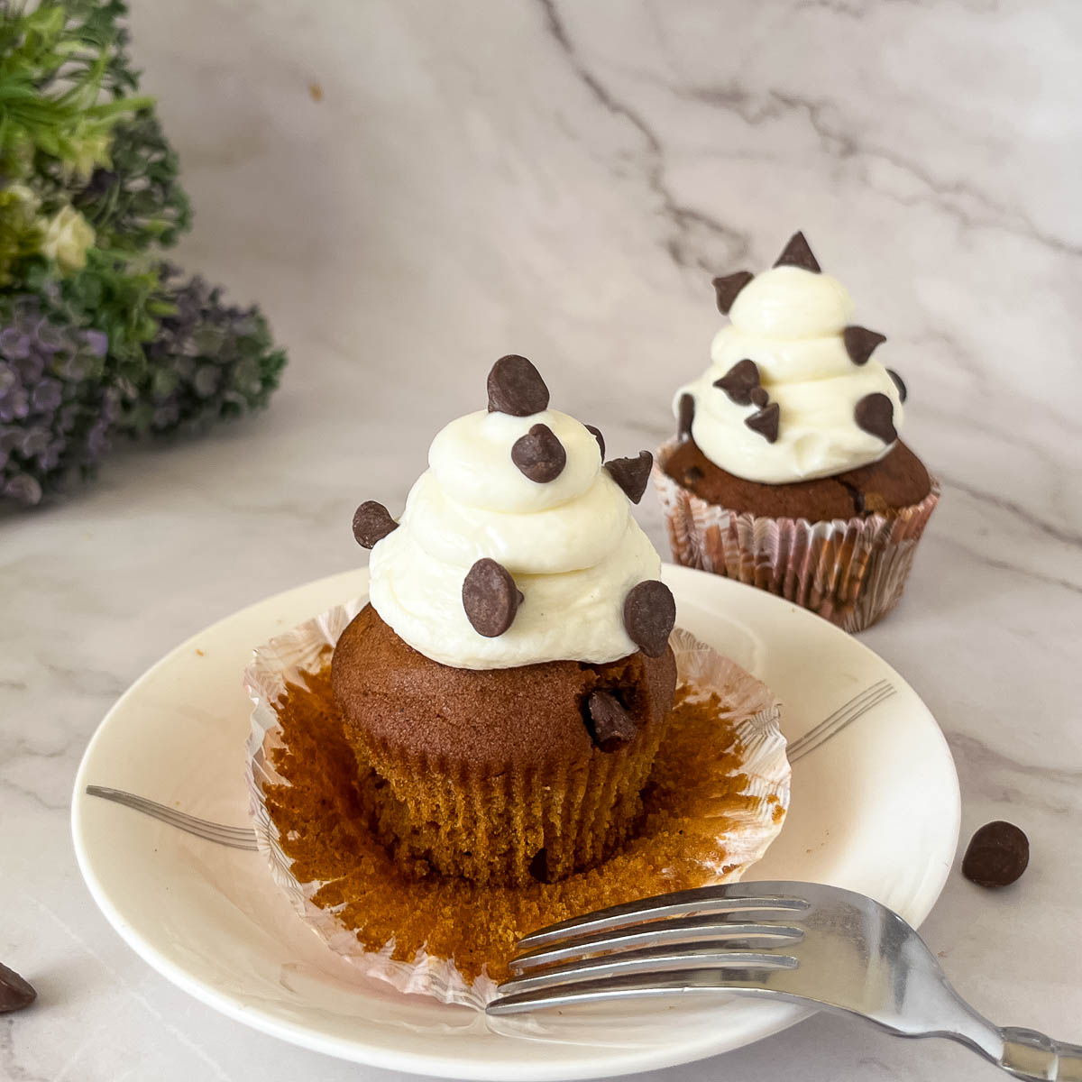 Frosted cupcakes on the table.